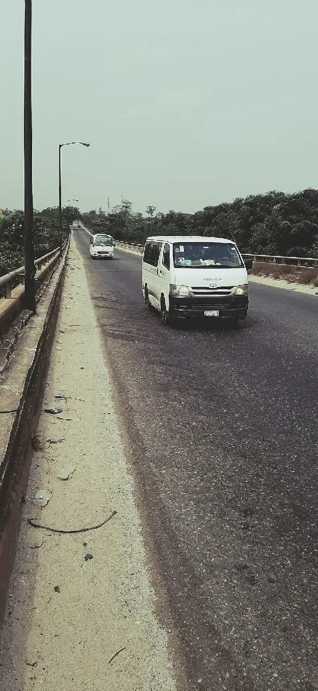 A commercial bus in transit on a Nigerian road
